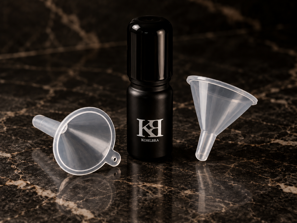 KOHLBRA refill kohl eyeliner bottle with translucent funnels for easy application and precise makeup touch-ups.